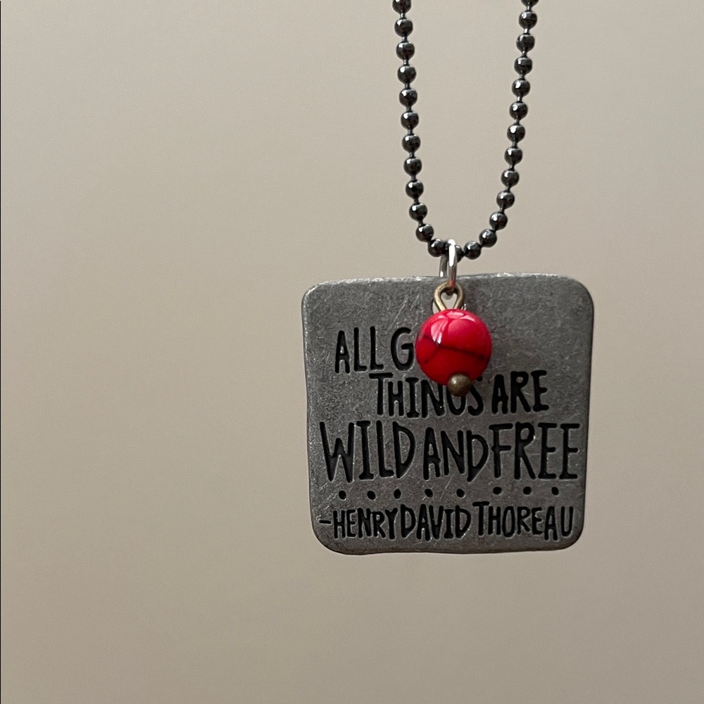 Red and black round gemstone with quote pendant necklace